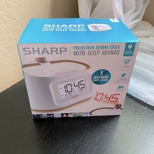 SHARP. Projection alarm clock with sleep sounds.